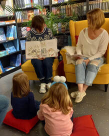 Picture Heather at bookstore reading to children